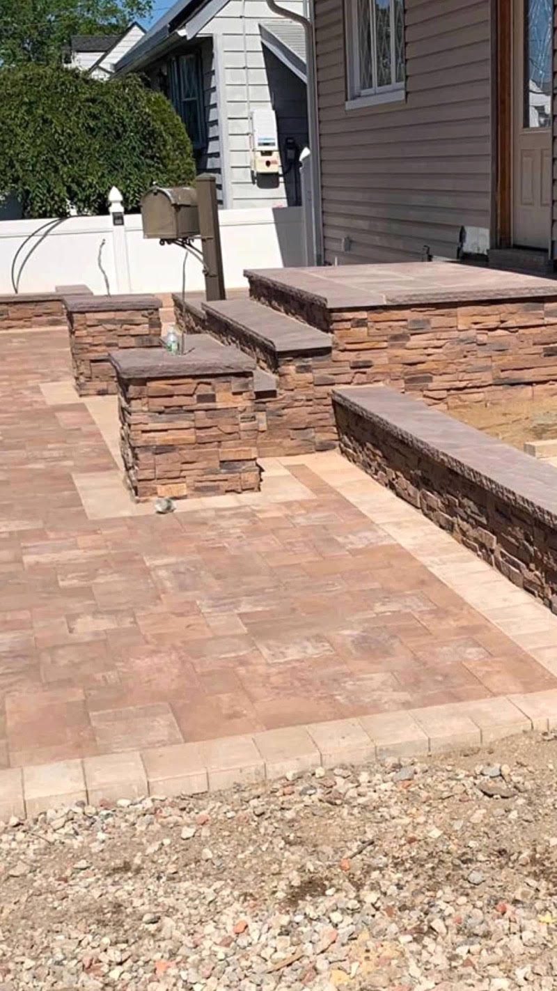 Raised paver stoop and seat wall under construction