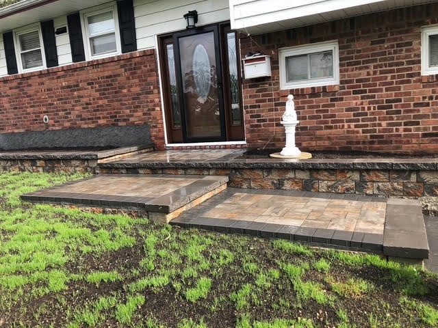 Bluestone front steps and walkway at a brick home