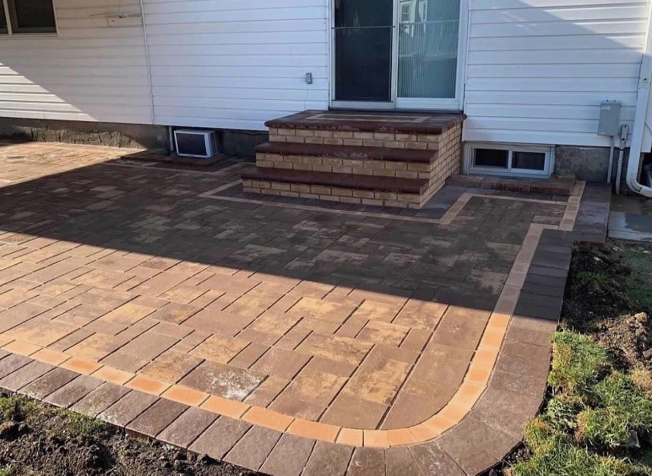 Brick steps with paver patio and contrasting soldier-course border