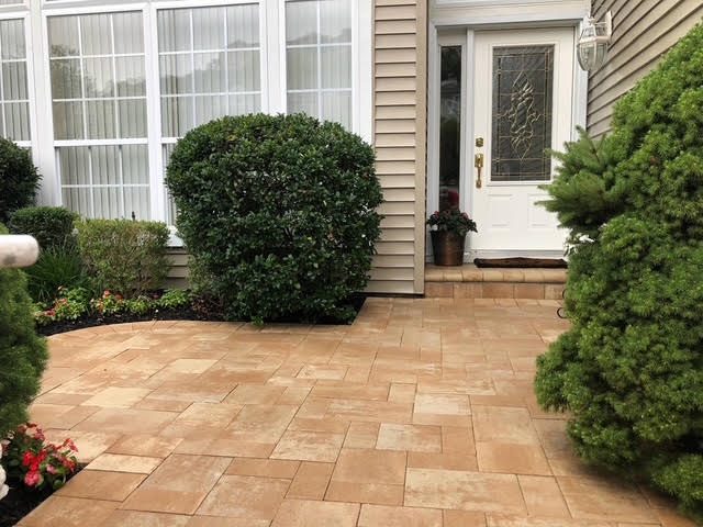 Paver front entry patio and walkway beside the front door