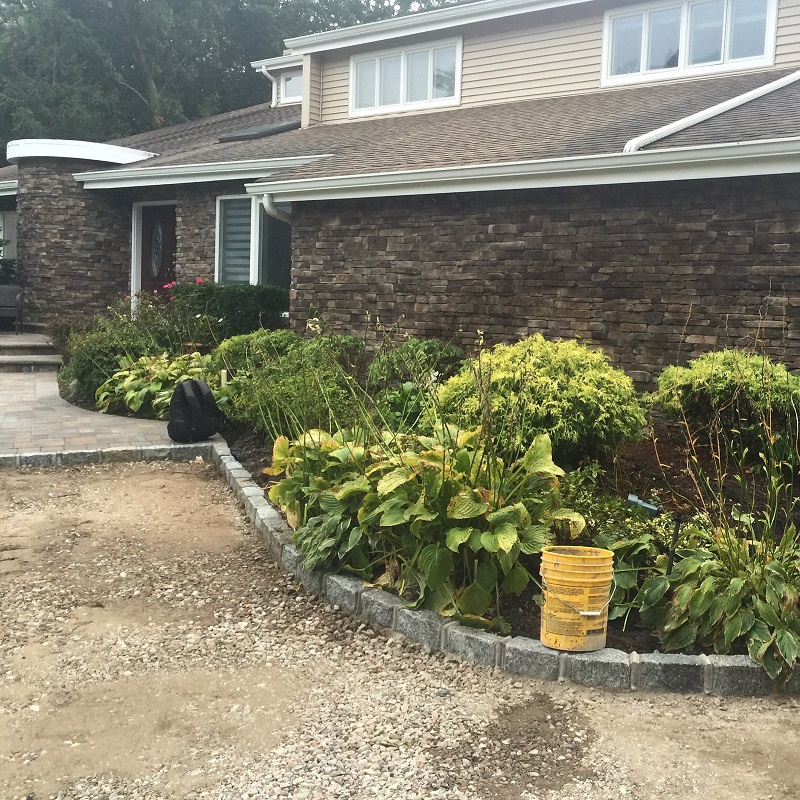 Stone veneer wainscoting on a front elevation