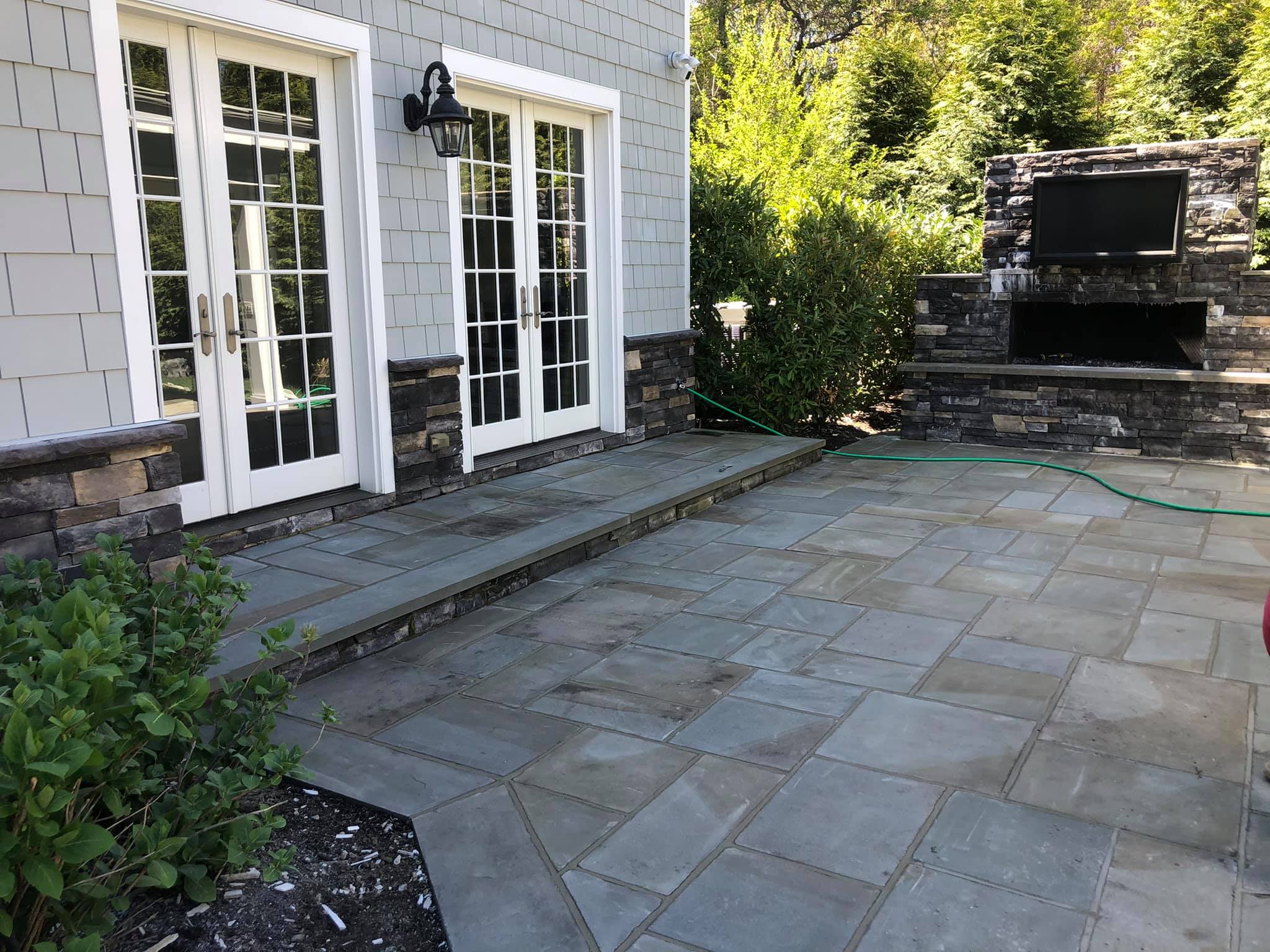 Backyard paver patio installation on Long Island