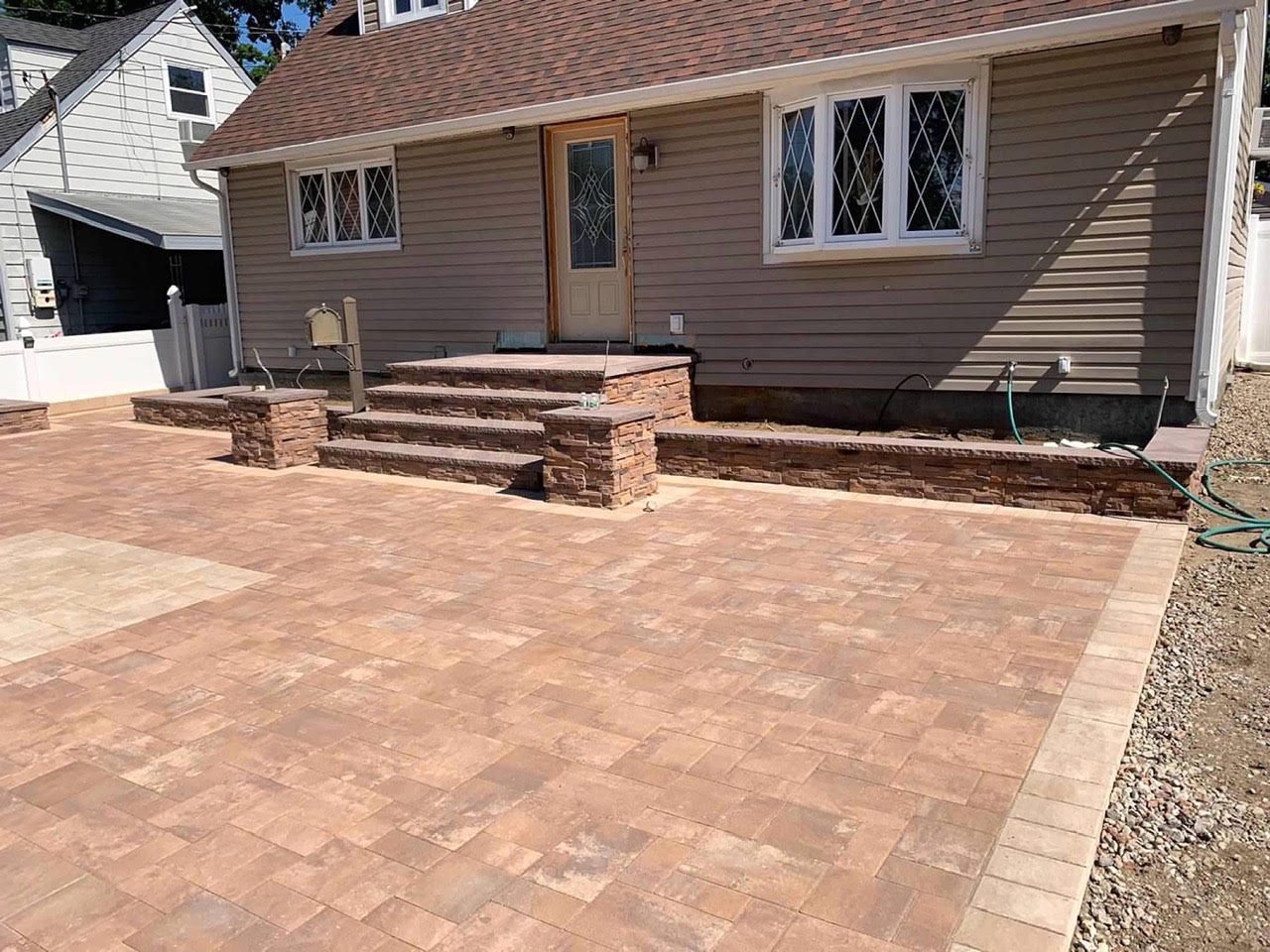 Paver walkway and front steps rebuilt on a ranch home